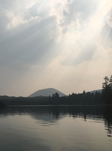 kayaking butte lake in lassen national park in northern california, view from water in smoke