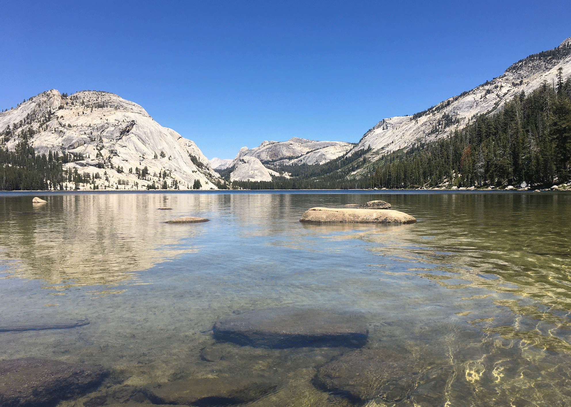 Header for page on kayaking the central sierra featuringa photo of tenaya lake in yosemite, california